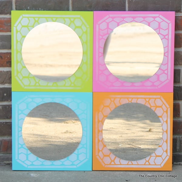 DIY Color Block Mirror -- make this mirrored art for any room in your home easily with a few simple steps. Click to see where to buy the boards, mirrors, paint and stencils to make this great mirror! finished DIY color block mirror