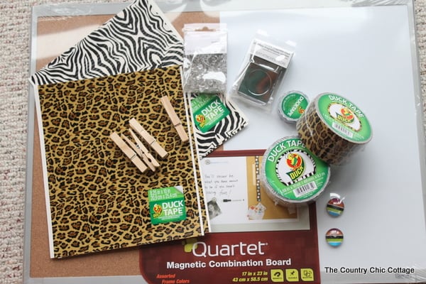 supplies for a dorm organization board decorated with Duck Tape®.