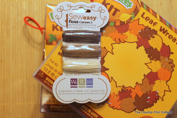 Fall Felt Leaf Garland -- add this to your fall decor. Super simple to make with pre-cut felt leaves and some thread. Come get the full instructions. fall felt garland project supplies
