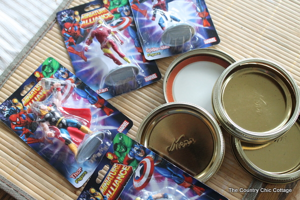 Make great super hero jar toy storage in minutes with this super simple tutorial. Plus learn all about the new Super Buddies movie from Disney. superhero figures and lids