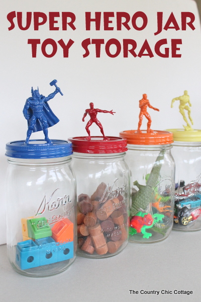 Make great super hero jar toy storage in minutes with this super simple tutorial. Plus learn all about the new Super Buddies movie from Disney. four jars filled with toys