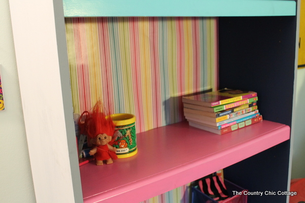 Color Block Book Shelf -- learn how to paint your own book shelf with a color block twist. A colorful addition to any kid or teen room...or change up the colors for any space in your home.