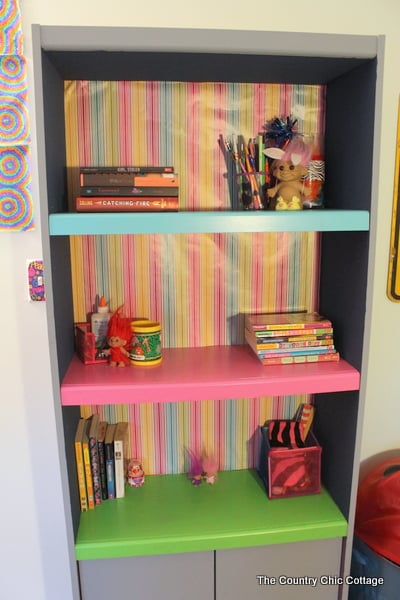 Color Block Book Shelf -- learn how to paint your own book shelf with a color block twist. A colorful addition to any kid or teen room...or change up the colors for any space in your home.