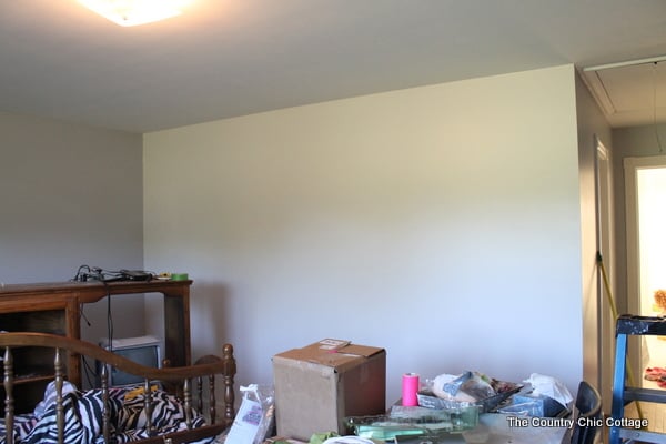 How to Paint a Gradient Wall -- learn how to get that ombre or gradient look on the wall of your home with this method. This wall looks like a paint chip with horizontal lines running through it. The post even shows how to do the math and calculate where your lines go! The best way to paint a gradient wall is to start with a plain or neutral colored wall