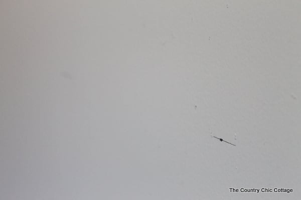 How to Paint a Gradient Wall -- learn how to get that ombre or gradient look on the wall of your home with this method. This wall looks like a paint chip with horizontal lines running through it. The post even shows how to do the math and calculate where your lines go! You can always remeasure and mark your stripes before painting to make sure they're perfect!