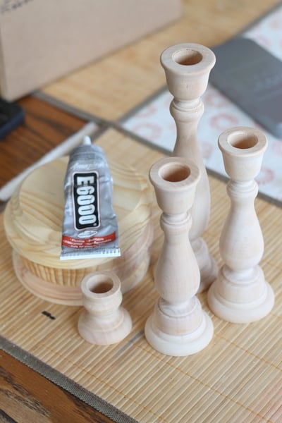 Pottery Barn Knock Off Candle Holders and Candles -- a super simple way to make your own extra tall candle holders from cheap craft store wooden items.