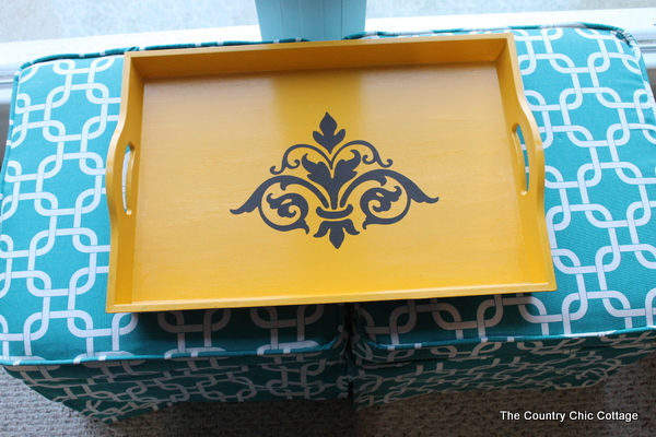 DIY Upholstered Coffee Table -- use reupholstered ottomans and a tray as a coffee table. Easy to do it yourself from thrift store finds!