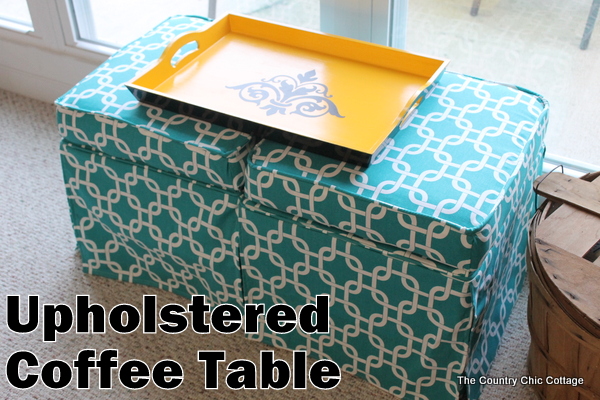 DIY Upholstered Coffee Table -- use reupholstered ottomans and a tray as a coffee table. Easy to do it yourself from thrift store finds!