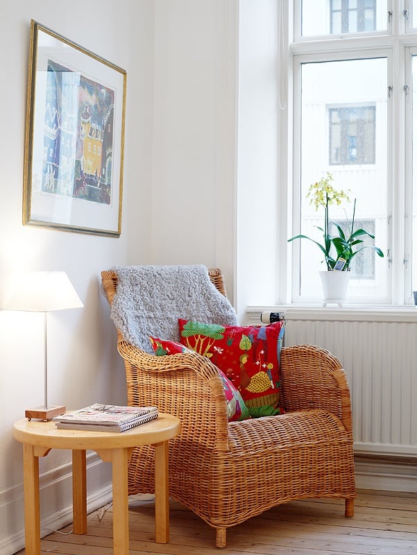 wicker chair with bright pillow