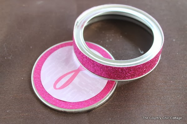adding pink ribbon to mason jar lid
