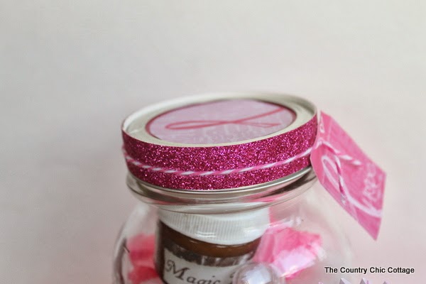 breast cancer ribbon gift tag on a jar