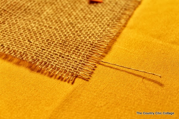DIY Burlap Thankful Place Mats -- the perfect place mats to make for your Thanksgiving feast. Super simple to make and you can use the word "thankful" or the word of your choice. burlap on table