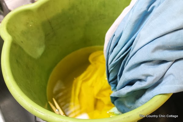 DIY Tie Dye Curtains -- learn how to make your own striped tie dye curtains in any color of the rainbow. Making tie dye curtains is a fun project that will add a pop of color to a kids bedroom or play room!