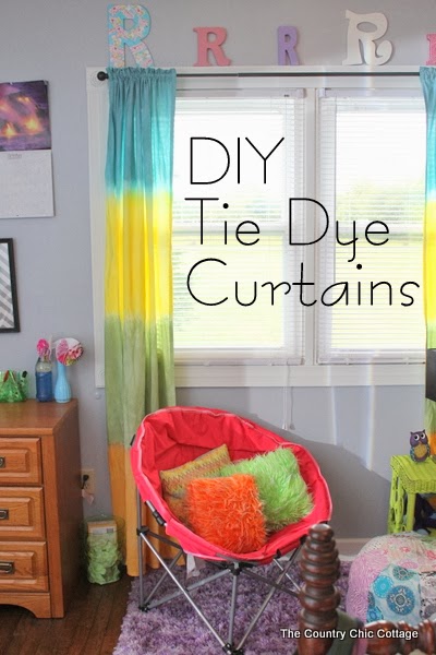 DIY Tie Dye Curtains -- learn how to make your own striped tie dye curtains in any color of the rainbow. How to make your own DIY tie dye curtains! Perfect for a kids bedroom or playroom.