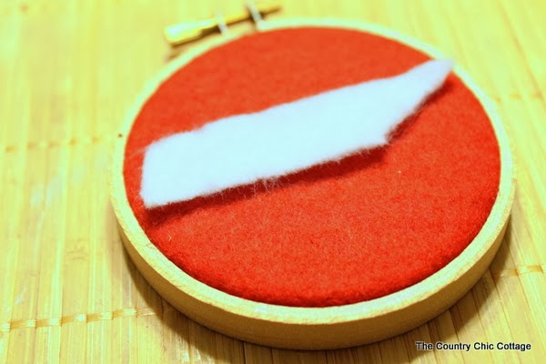 Handmade Gift Idea: 8 hoop ornaments that can be given as gifts this year. Ideas for everyone on your Christmas list. A hoop ornament decorated with the state of Tennessee