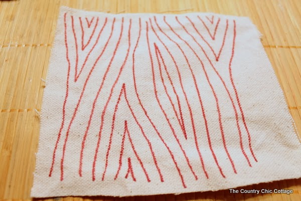 Sewing faux wood grain on scrap fabric 