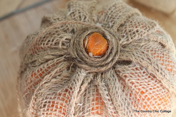 Wrap the step of your burlap pumpkin with jute twine--this makes it look more like a natural pumpkin stem