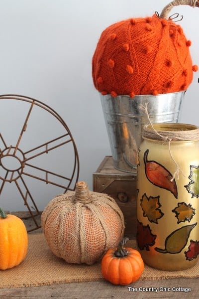 Make Your Own Burlap Pumpkin -- take a dollar store pumpkin and make it extra special with burlap! These easy DIY burlap pumpkins are the perfect addition to any fall decor!