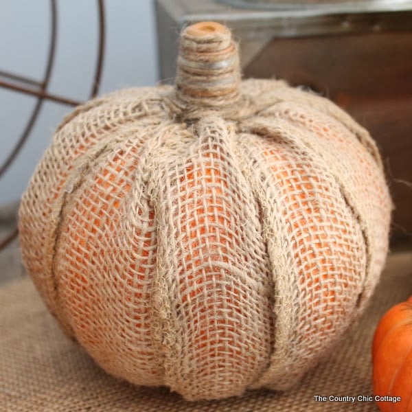 Make Your Own Burlap Pumpkin -- take a dollar store pumpkin and make it extra special with burlap! this burlap pumpkin tutorial is the perfect way to add a touch of rustic decor to your home!