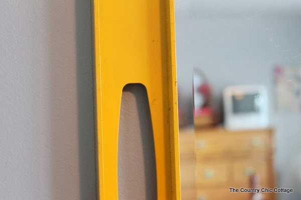 Painting frames around mirrors -- take plain build grade frameless mirrors and add flair for just the cost of paint. Come see how! Level on wall for making painted mirror frame