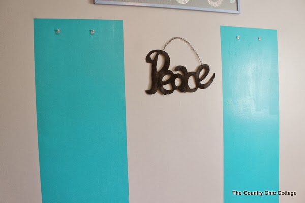 Painting frames around mirrors -- take plain build grade frameless mirrors and add flair for just the cost of paint. Come see how! Painting wall for painted mirror frames