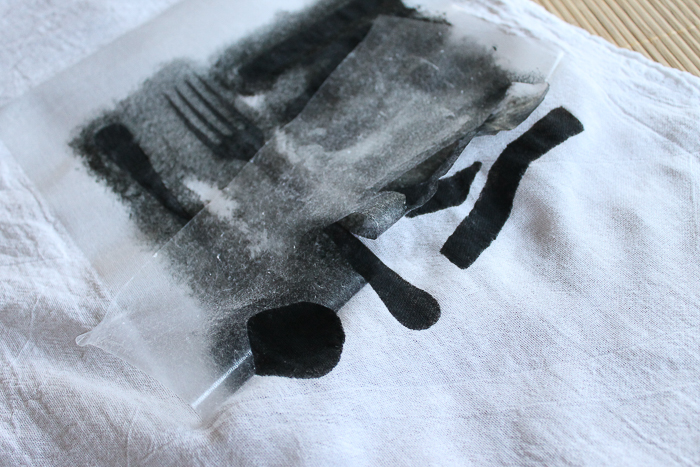 stenciling a dish towel