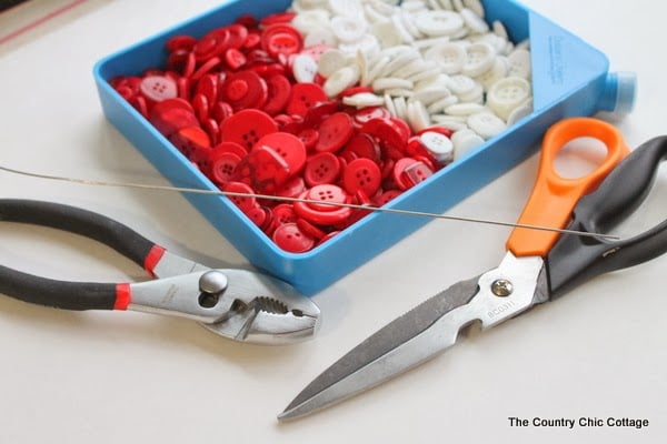 Button Candy Cane Christmas Ornaments -- handmade ornament tutorial that will have your tree full of button candy canes in no time. image of buttons, floral wire, and scissors