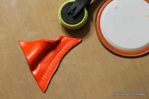 adding texture to Sculpey clay Santa hat