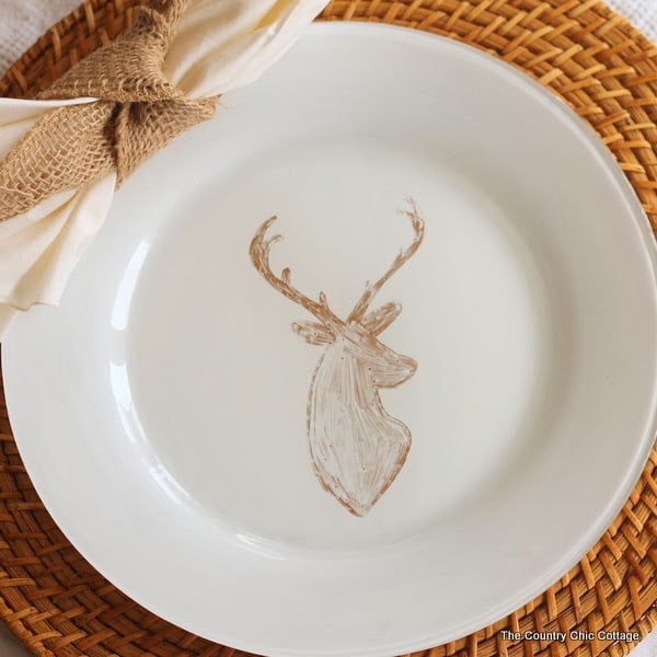 DIY Deer Painted Plates -- a quick 10 minute way to make gorgeous custom designed plates with a sharpie and paint! hand-painted deer plates on a place setting