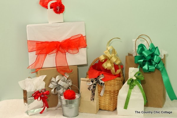 DIY Handmade Bows with the Bowdabra -- a quick and easy way to make bows for your holiday packages. handmade bows in gold, green and red.