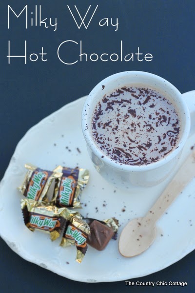 hot chocolate in white mug with chocolate shavings and milky way mini chocolates