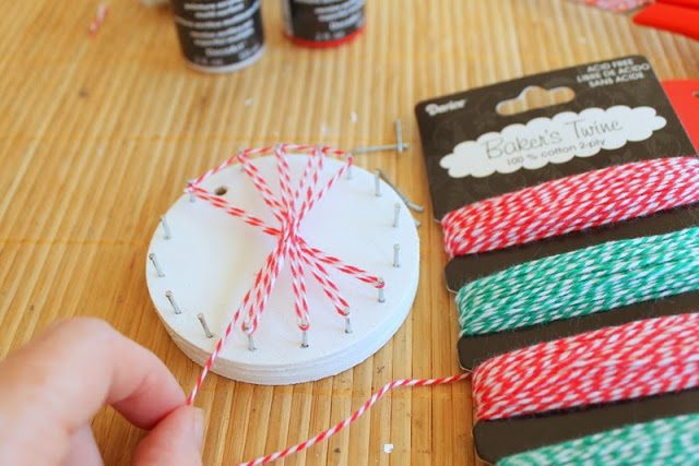 wrapping twine to make Christmas String Art Ornaments