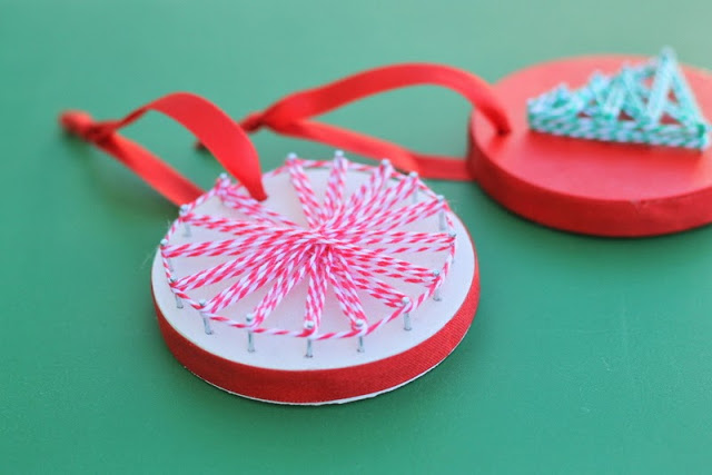 String Art Ornaments -- a fun and unique craft project to make with your kids this Christmas -- grab some wood and string to get started. Christmas String Art Ornaments