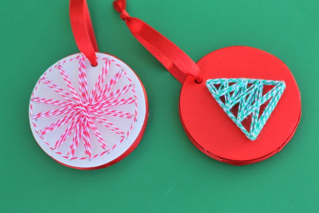 String Art Ornaments -- a fun and unique craft project to make with your kids this Christmas -- grab some wood and string to get started. Christmas String Art Ornaments on green background