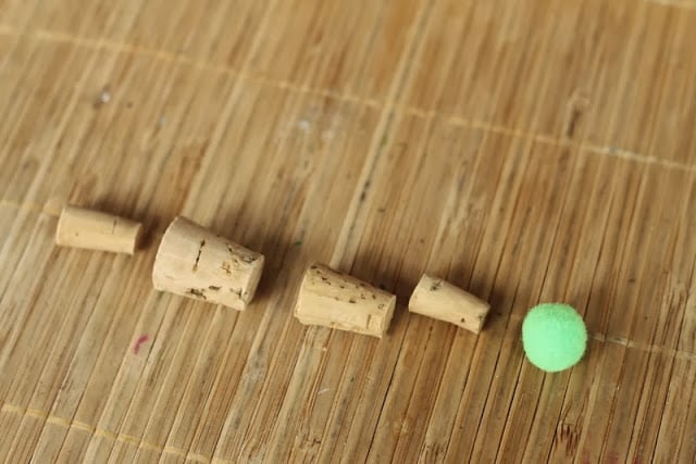 forming a tree shape with wine corks