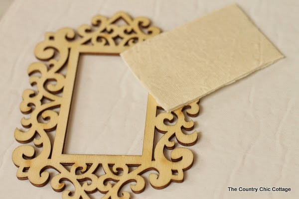 DIY Gold Frame Ornament -- an easy ornament that will look elegant on any tree this holiday season. Click the picture to learn how to make your own.