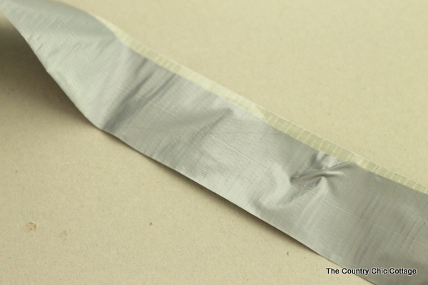 Gift wrap for men with duct tape -- a fun way to wrap gifts for guys! Learn how to make a bow from duct tape! putting sticky sides of duct tape together
