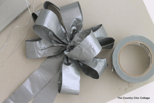 Gift wrap for men with duct tape -- a fun way to wrap gifts for guys! Learn how to make a bow from duct tape! DIY duct tape bow