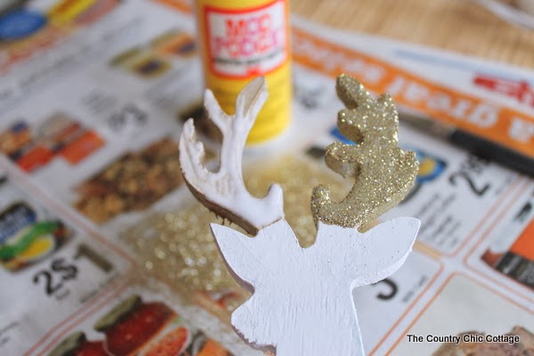 Glitter Dipped Deer Silhouettes -- perfect for your home in any season learn how to make this deer decor for your home. Click on the picture to head to the craft tutorial.