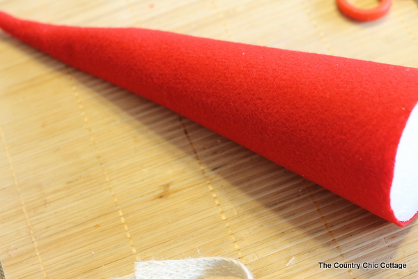 How to make an Elf Mason Jar Gift for Christmas -- learn how to make this fun craft for anyone on your gift giving list. covering the cone with felt