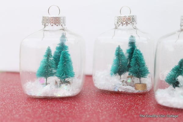 Kids Craft: Mini Snow Globe Ornaments -- click the picture to get the full instructions for making your own fun Christmas ornaments.