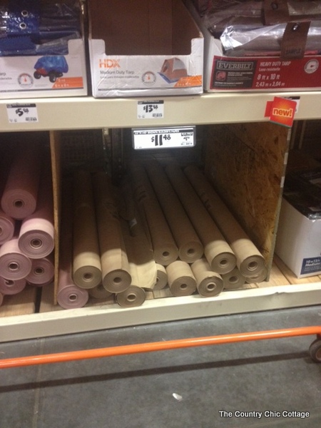 Gift wrap for men with duct tape -- a fun way to wrap gifts for guys! Learn how to make a bow from duct tape! rolls of brown paper in Home Depot