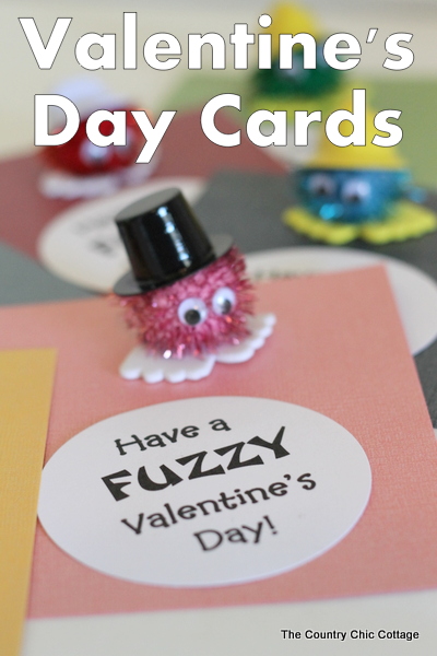 Homemade valentine card with pom-pom character and text overlay