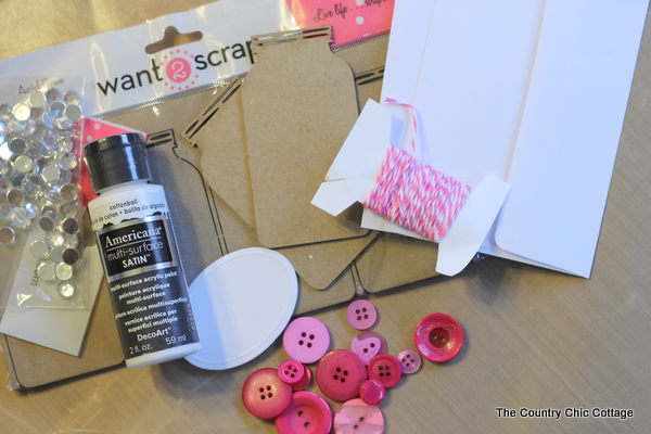 Mason Jar Valentines -- give a mason jar this Valentine's Day with this super simple button heart jar. Click to get the instructions on making your own.