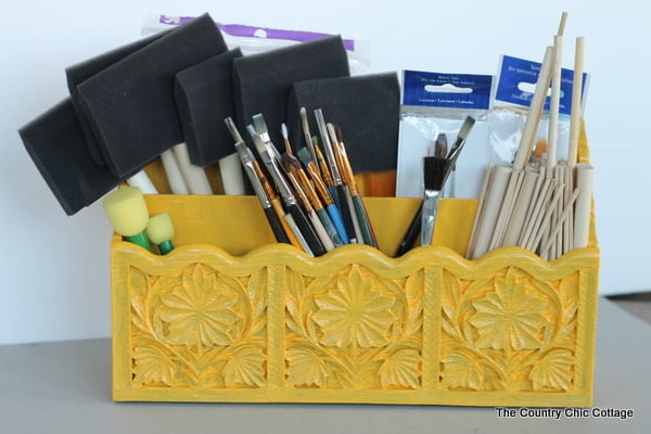 Paint brush organizer -- revamp a letter organizer to house your paint brushes with this super simple idea. yellow paint brush organizer