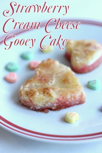 Strawberry Cream Cheese Gooey Cake -- perfect for serving heart shaped portions for Valentine's Day.