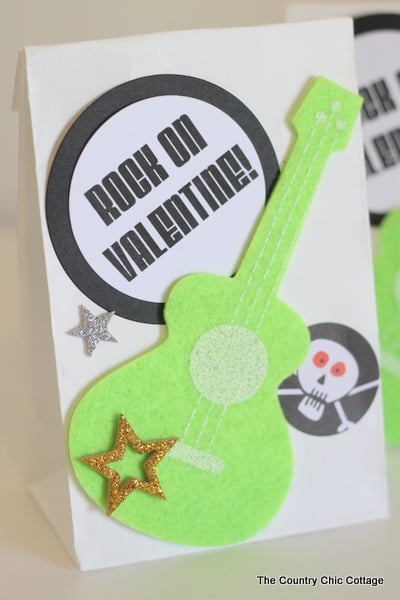 Valentine's Day Treat Bags -- handmade treat bag ideas for boys and girls all in one place. completed Valentine's day treat bag with green guitar