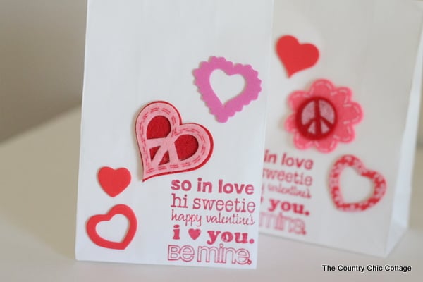Valentine's Day Treat Bags -- handmade treat bag ideas for boys and girls all in one place. completed Valentine's day treat bags with different types of hearts