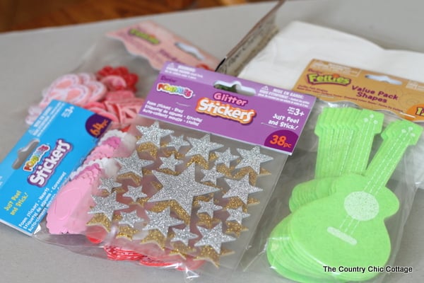 Supplies for handmade valentines treat bags laid out on table