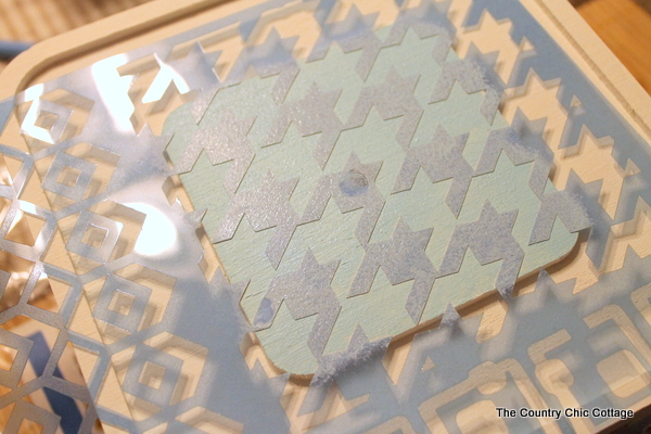 DIY Button Clock -- make your own button clock for a craft room or any room in your home. using stencil to paint a pattern on clock face